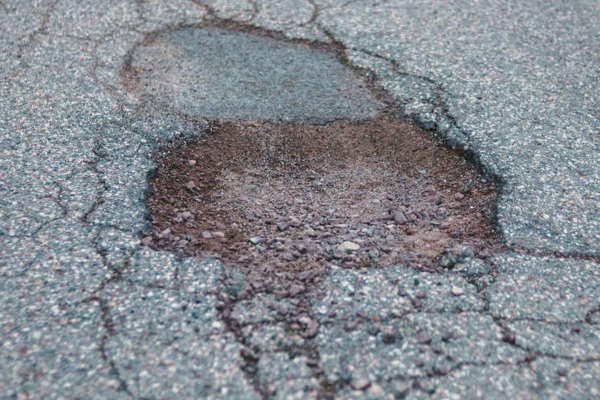 'Ugly' pothole repairs are temporary fixes says DOI