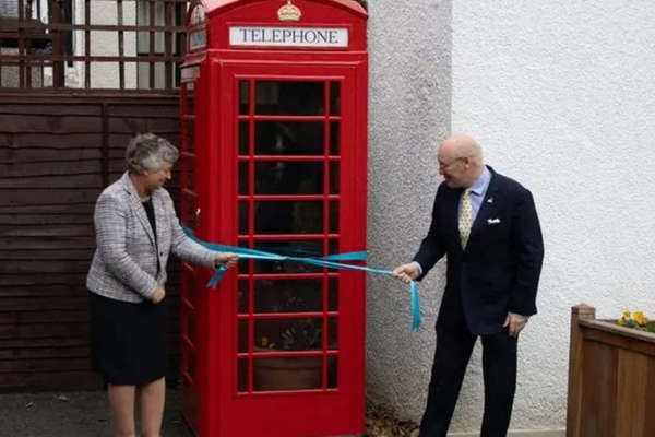 Phone box turns guide at government House